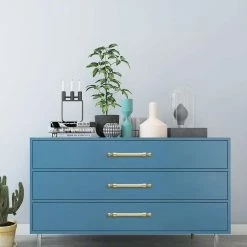 Utopia Alley 5 in. (128 mm) Center to Center Polished Gold Copper and Zinc Drawer Pull -idh by St. Simons Sales utopia alley drawer pulls hw390gd 66 1000